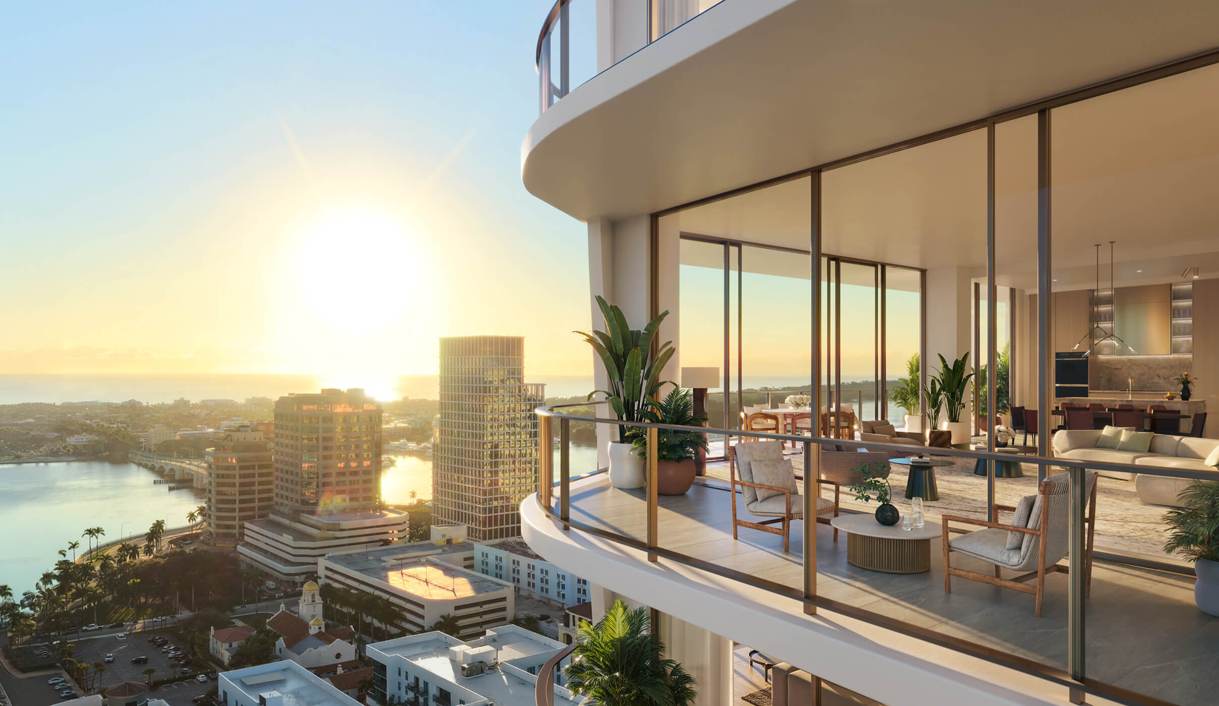 Banyan Tree West Palm Beach condominium building overlooking the downtown West Palm Beach skyline at sunrise.